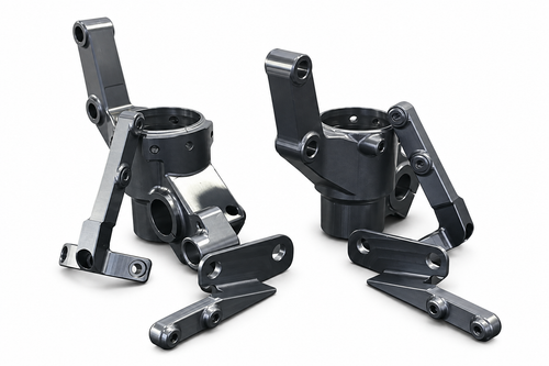 Piedini forcella dedicati MST0295 per kit avantreno Aprilia Tuareg 660, vista dei componenti su fondo bianco